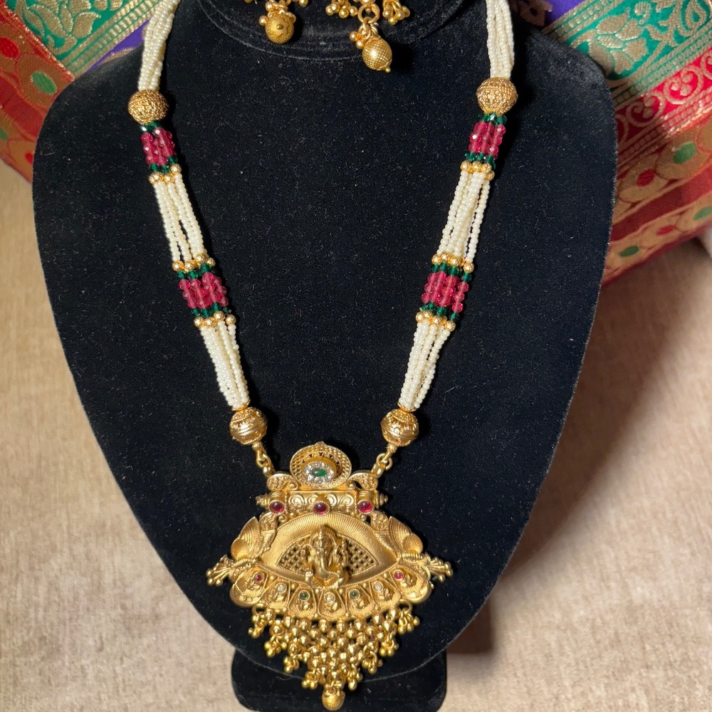 Long gold tone necklace with earrings